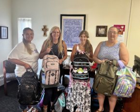 Stewart Financial book bag donation 2023